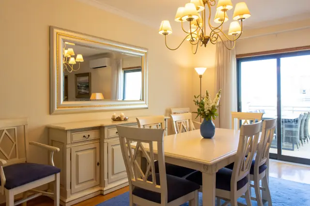 Dining table beside sliding doors onto the terrace.