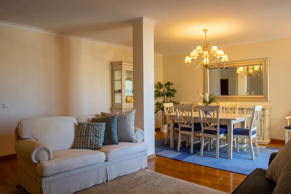 Cream sofa in the lounge with the dining area behind.